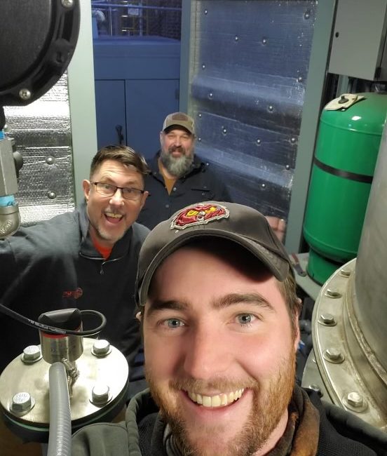 Bob Glass takes a selfie with some TRS coworkers.