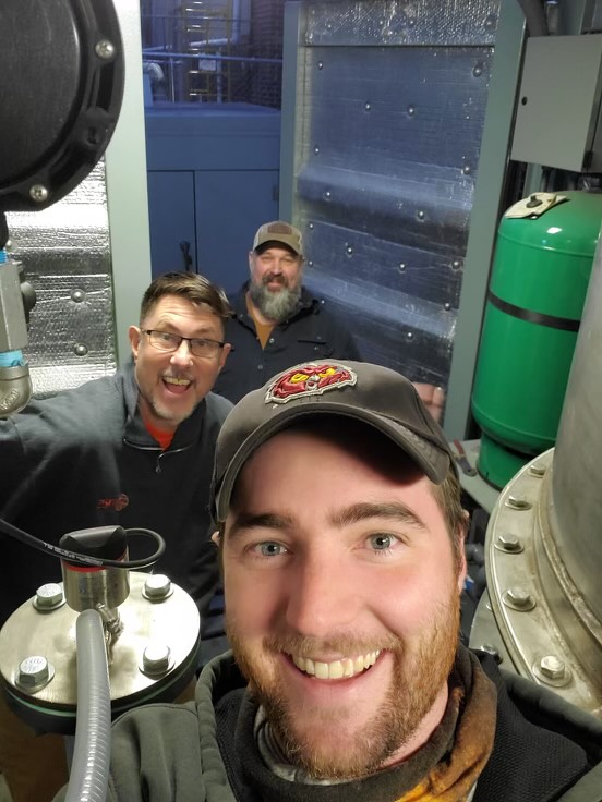Bob Glass takes a selfie with some TRS coworkers.