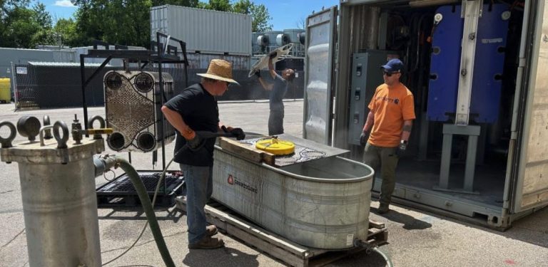 TRS personnel clean an LGAC skid at the TRS warehouse in Indianapolis.